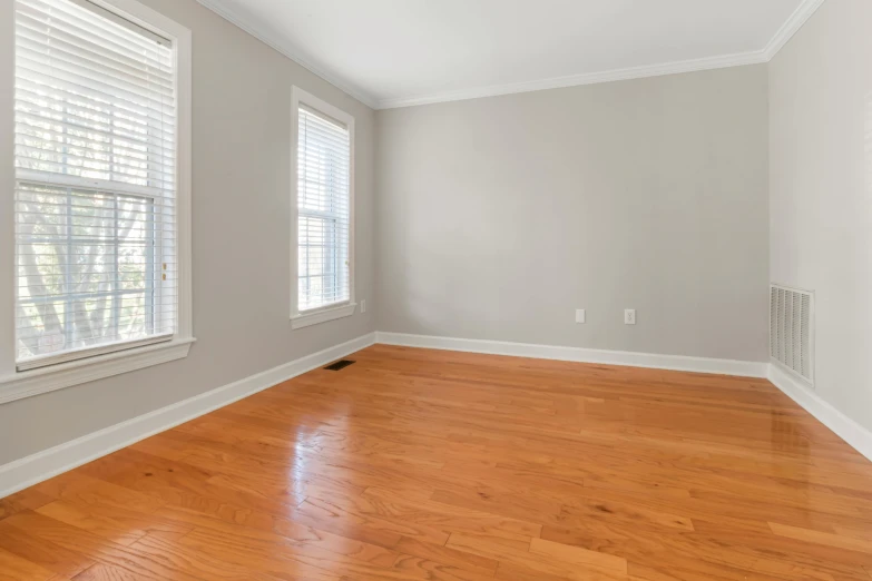 empty room with hardwood floor and grey walls