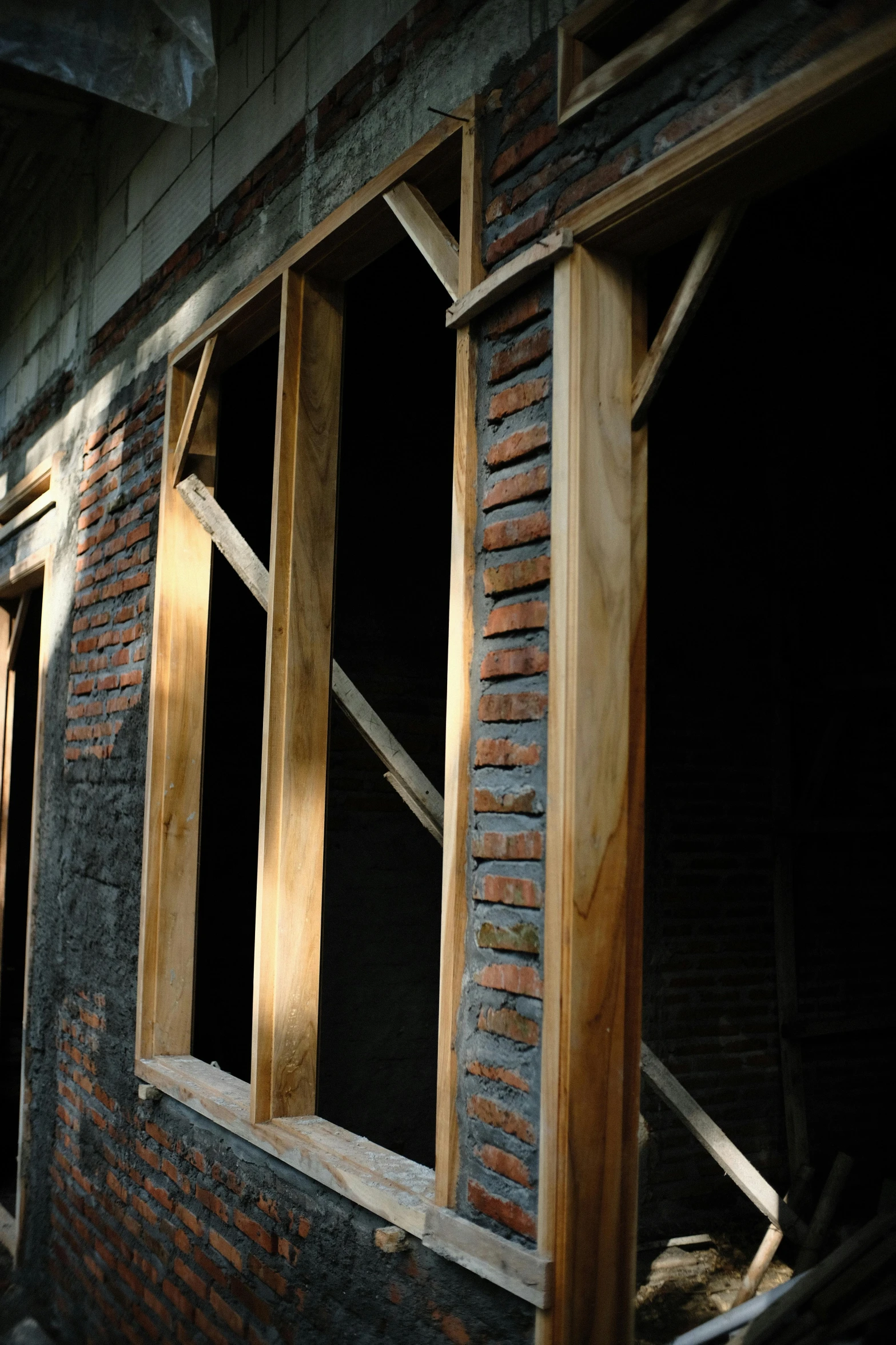 a building with exposed wood and some windows