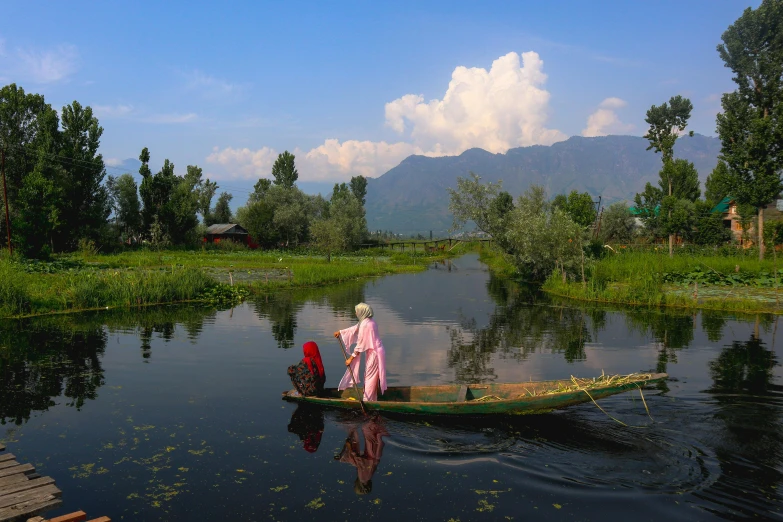 a man in a boat with some people standing up and looking into it