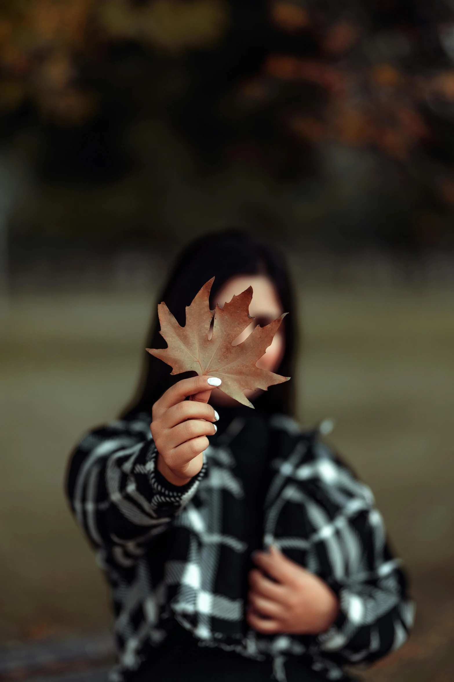 a person with a leaf on their face