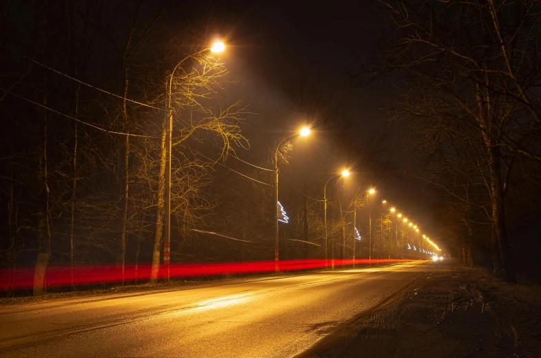 a street lights some trees lights and buildings