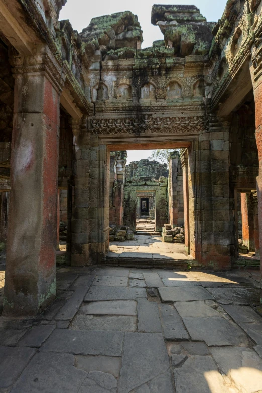 a doorway into a ruin with large columns