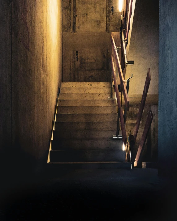 a dimly lit hallway with stairs and lights