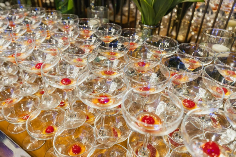 many glasses with different color on a table