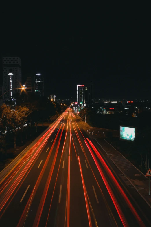 a large city street with light streaks going down it