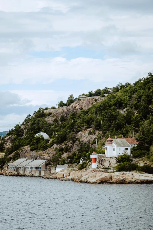 a small house sitting on top of a cliff