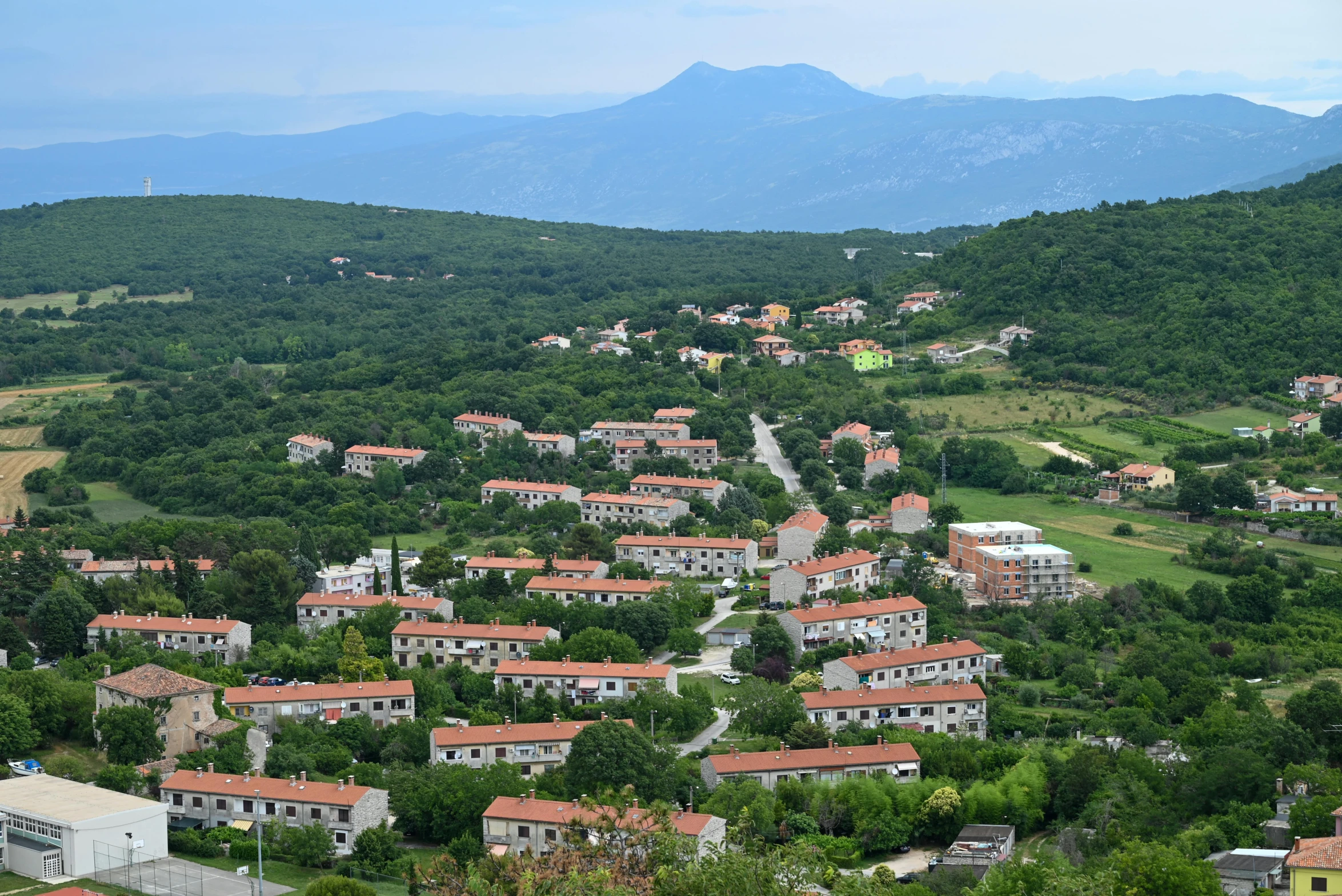 the town is nestled on a hilly hillside