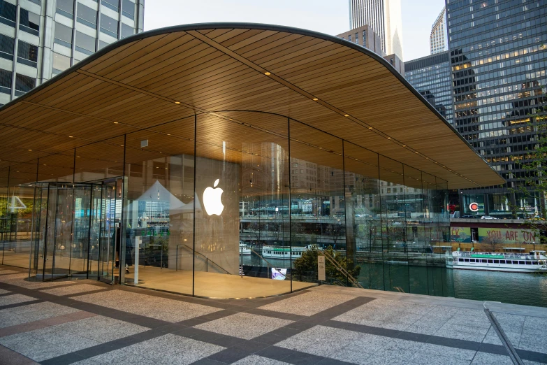 an apple store is situated on the side of the street