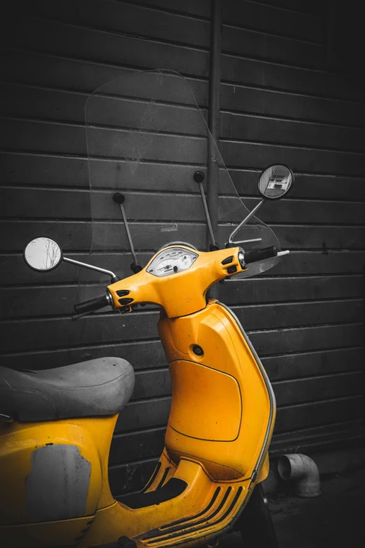 a moped parked outside next to a building