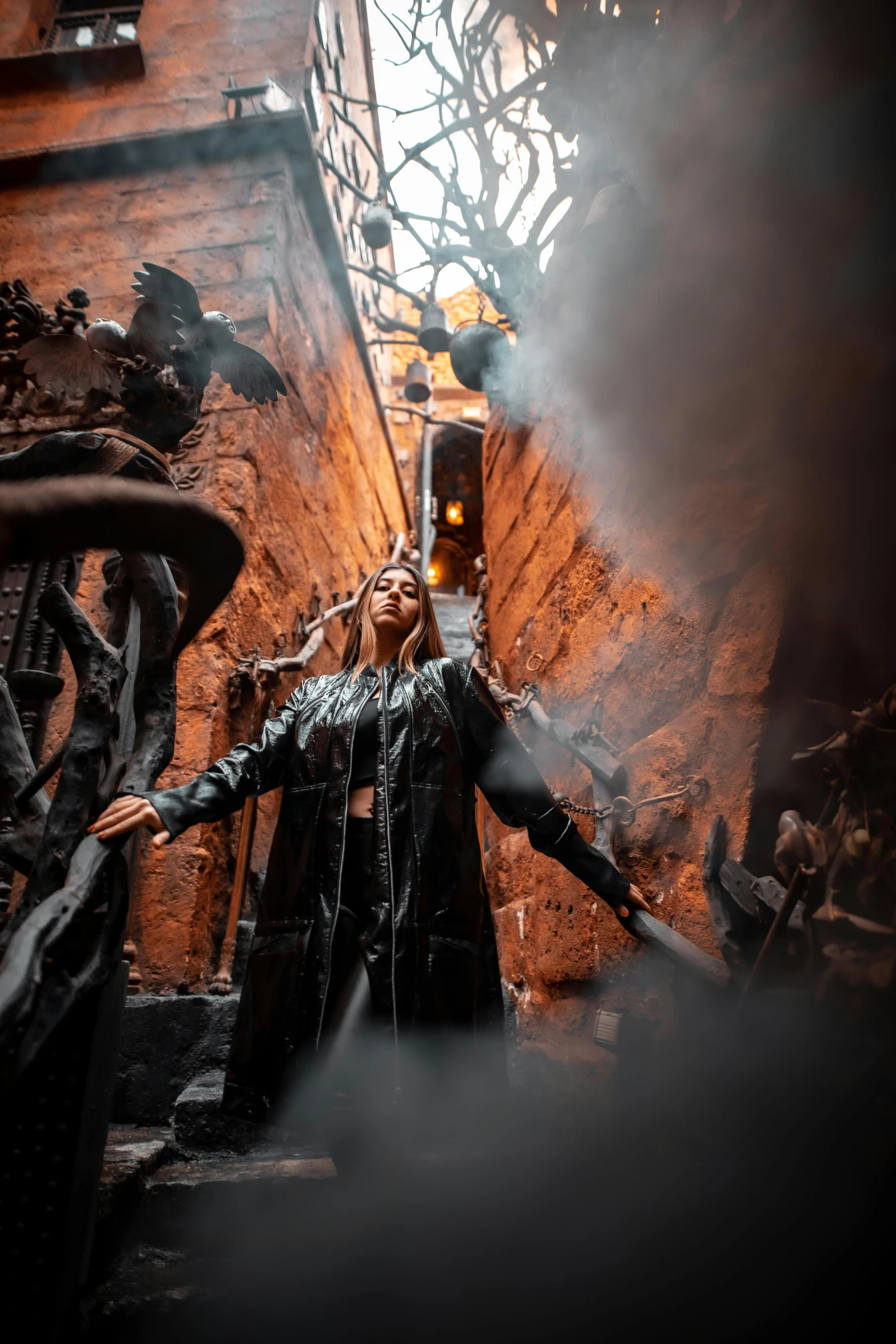 a woman standing in an alley way with a steam pouring out of her hair