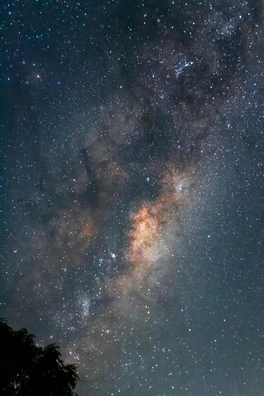 a man with backpack and a laptop under the stars