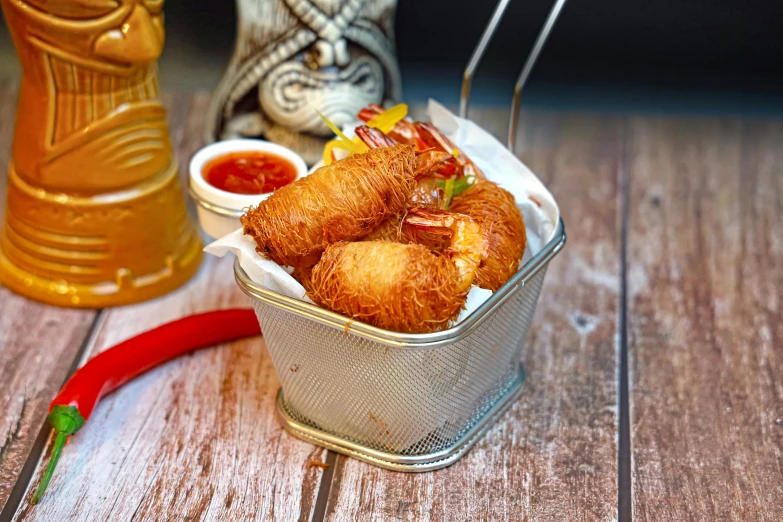 a close up of fried food in a tin