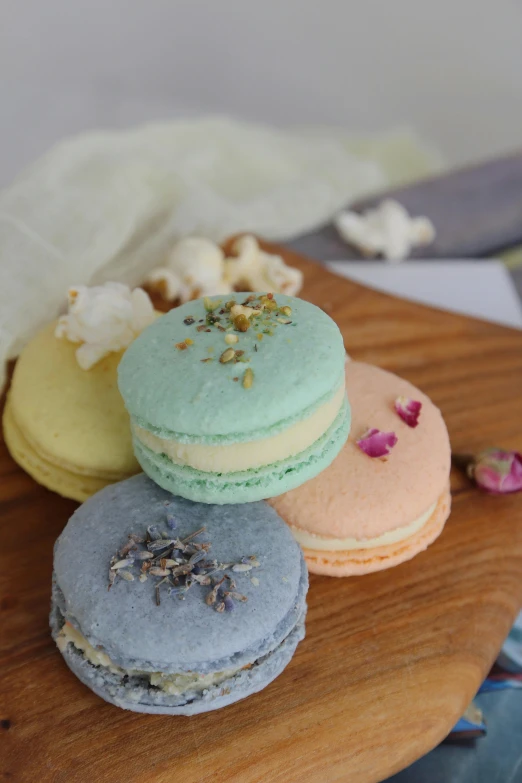 four different types of macarons sitting on a table