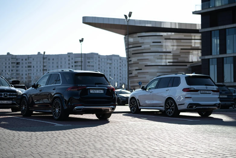 some cars that are sitting in the street