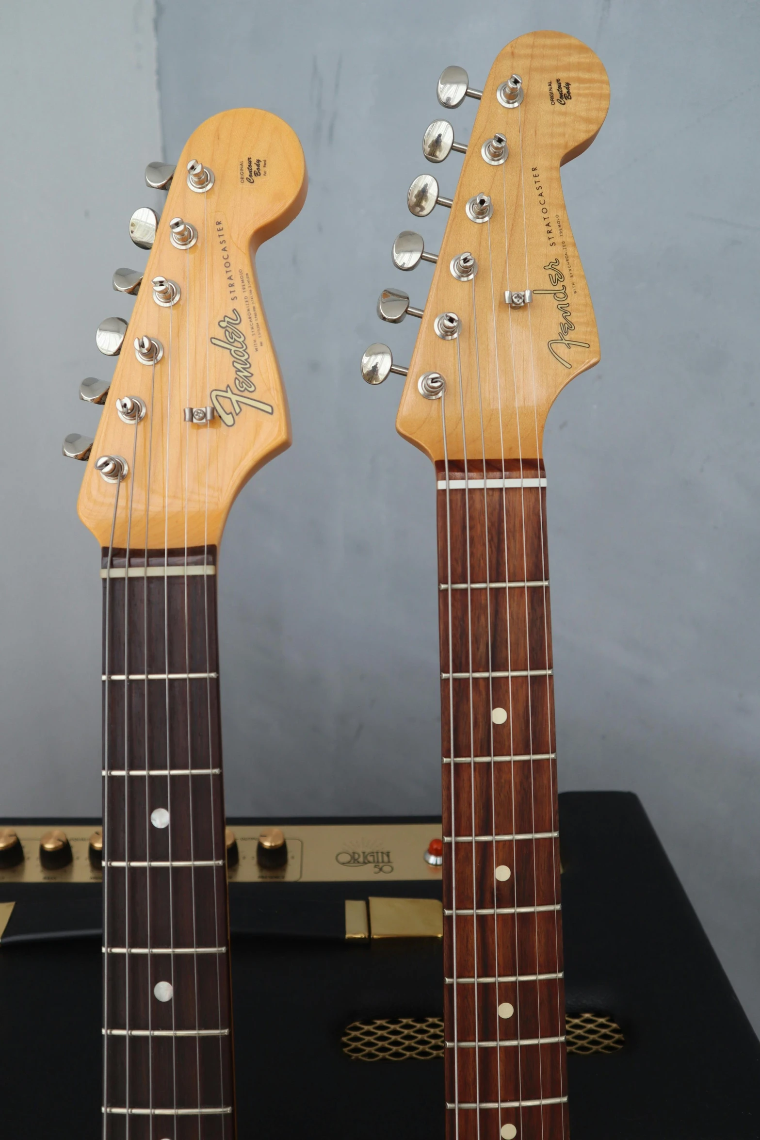 a couple of guitars sitting on top of each other