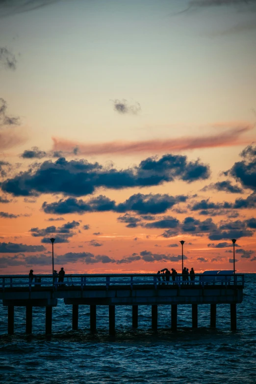 a body of water near a pier with people