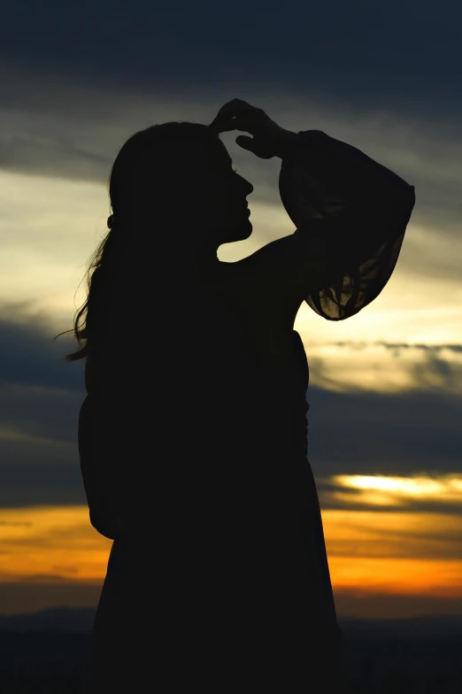 a person holds a black object in their hand