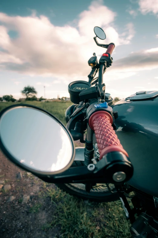 the mirror on the motorcycle is next to a bike