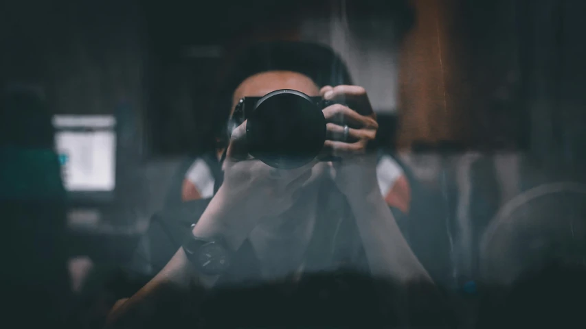 a woman taking a po with a digital camera