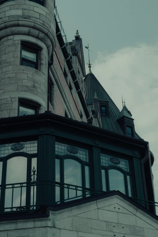 a building with multiple windows and sky in the background