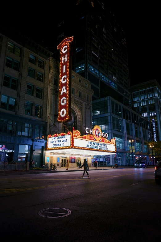 the chicago theatre is lit up at night