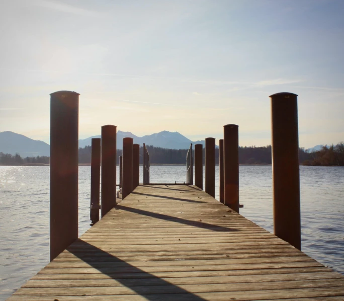 there is an old pier on the water