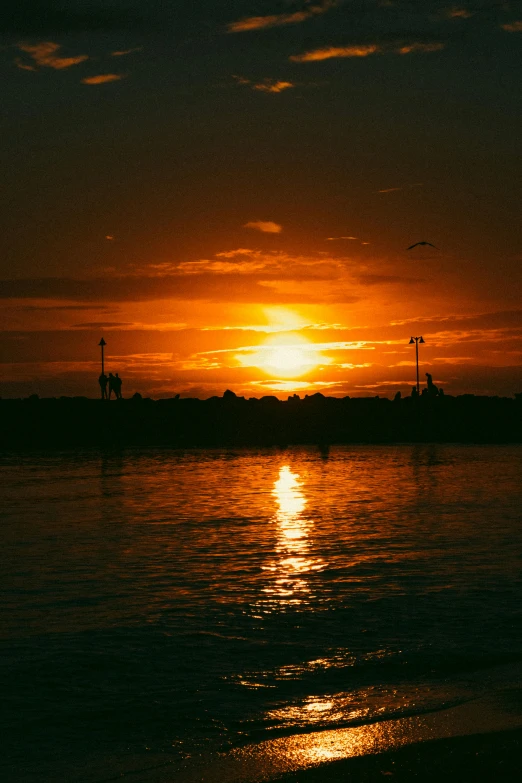 a beautiful sunset seen over the ocean water