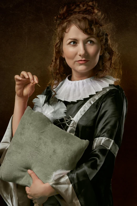 woman dressed in historical clothing holding cushion