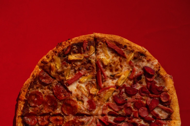 a pizza with pepperoni and other toppings is on display