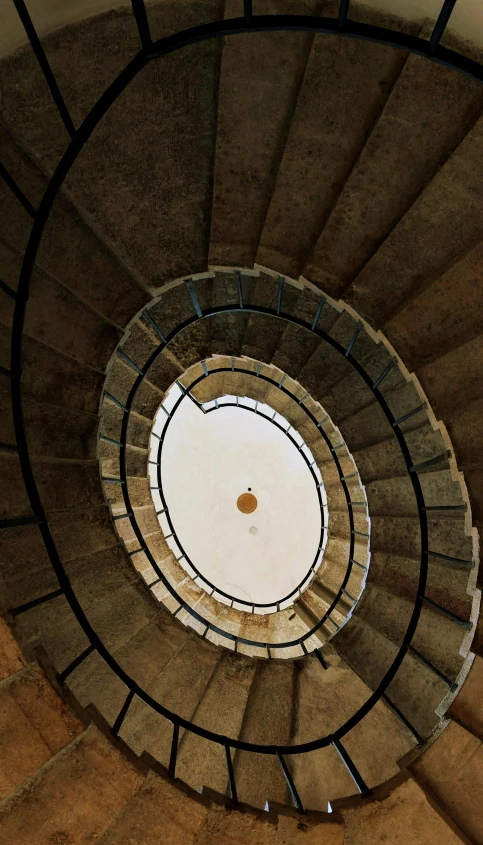 a spiral stair staircase going to the top