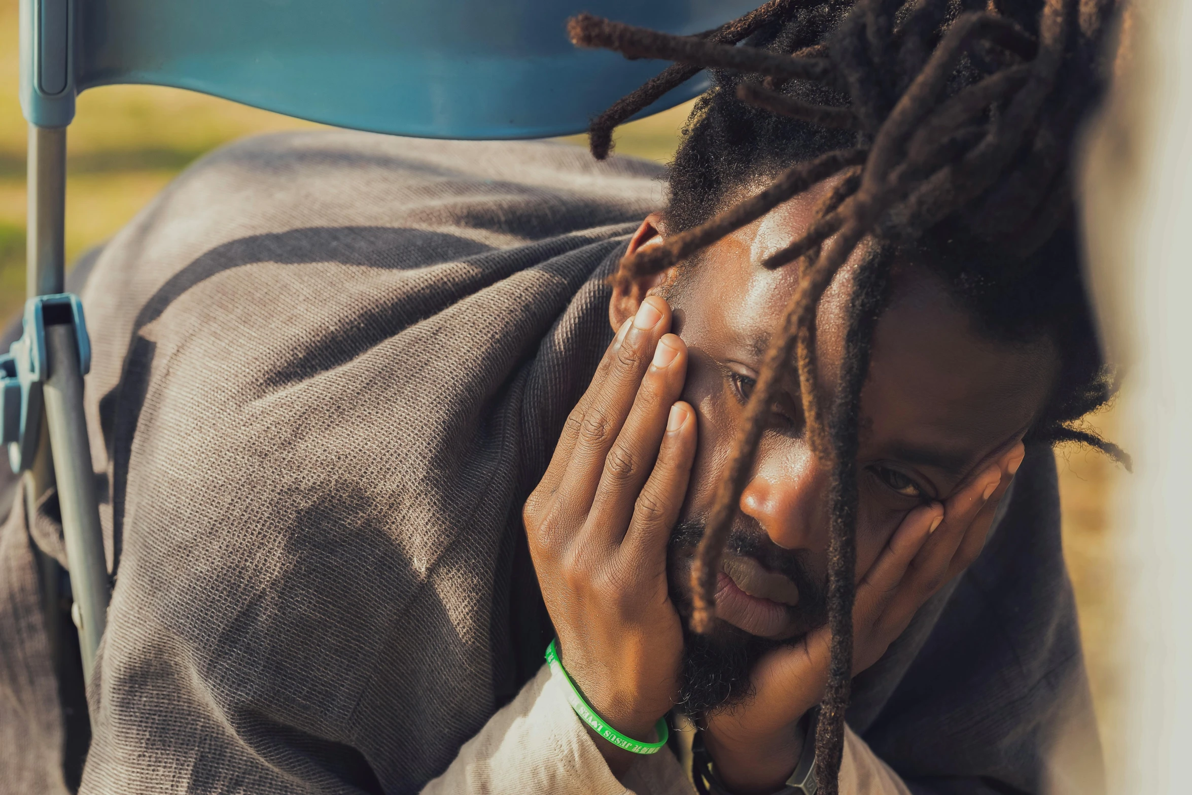 an african american man with dreadlocks in the desert