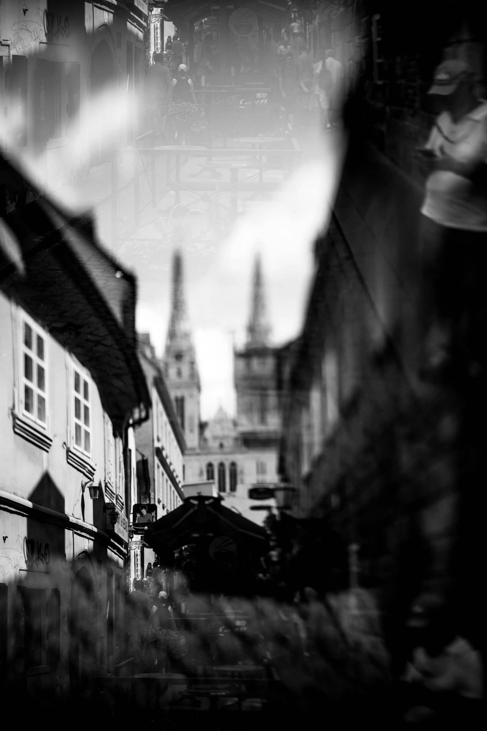 a town and some houses that are viewed through the windows