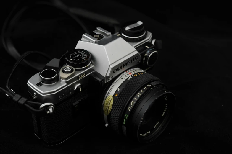 a camera on black background with the lens out