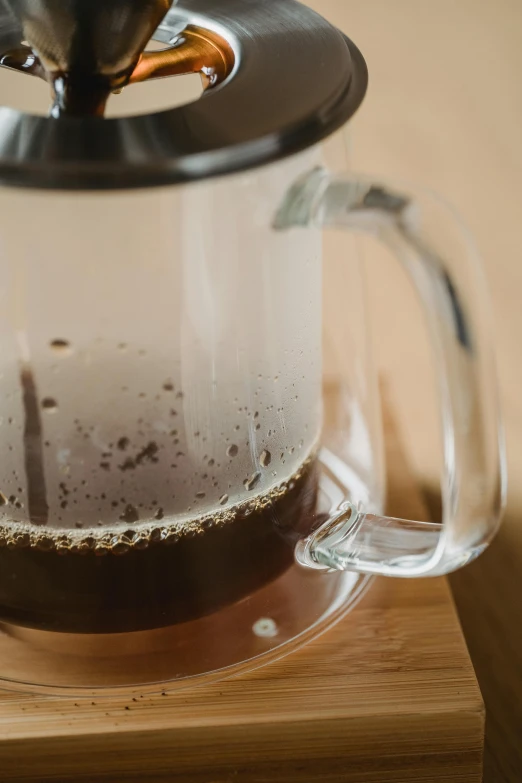 the inside of a coffee pot with some liquid in it