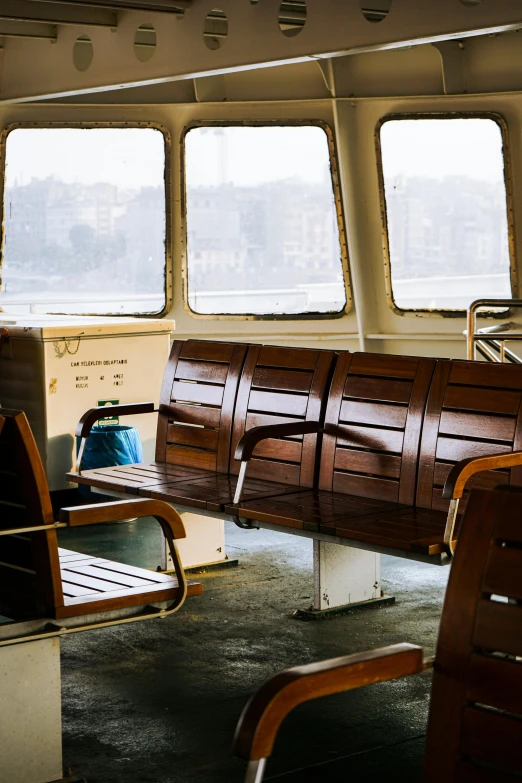 two benches and a wall in the front of a ferry