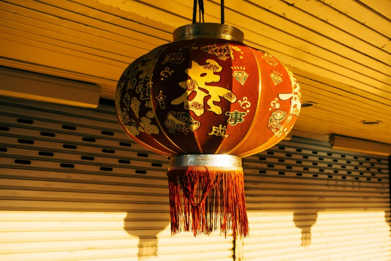 a hanging lantern hangs on the outside wall