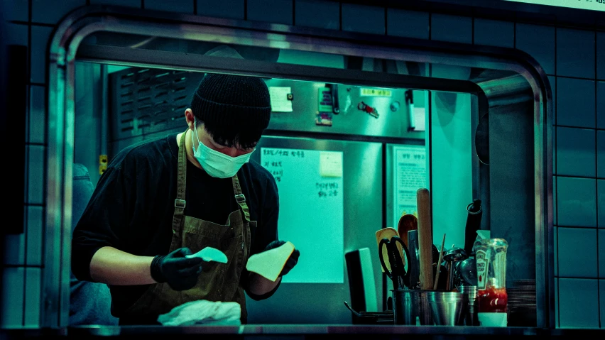 a man wearing a mask at a restaurant