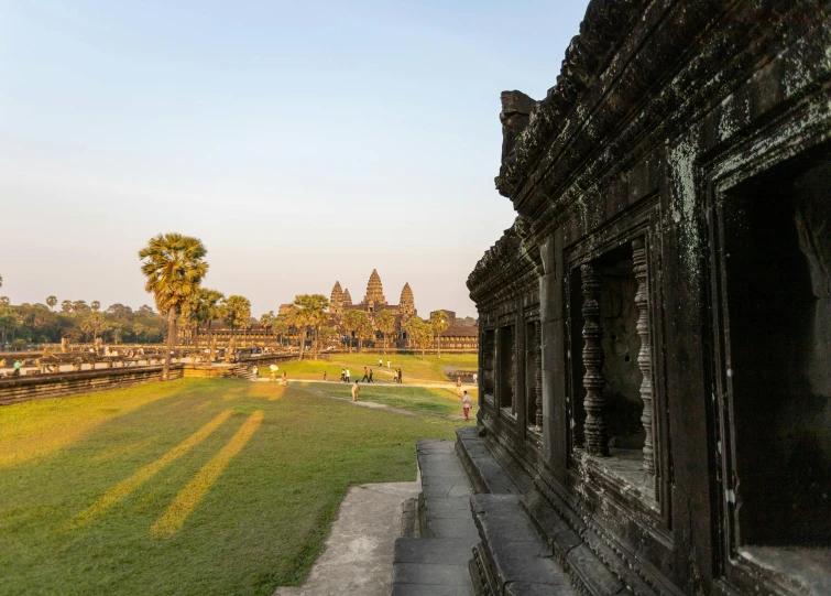 the view from a walkway leading to an outside area of a temple