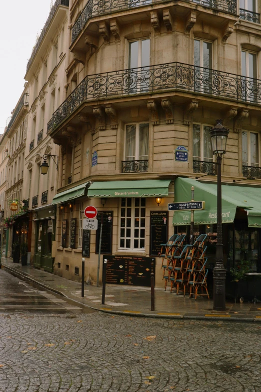 an image of a city street corner with a store