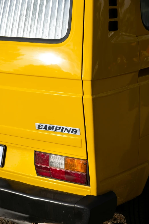 a yellow car with an exhaust pipe is parked