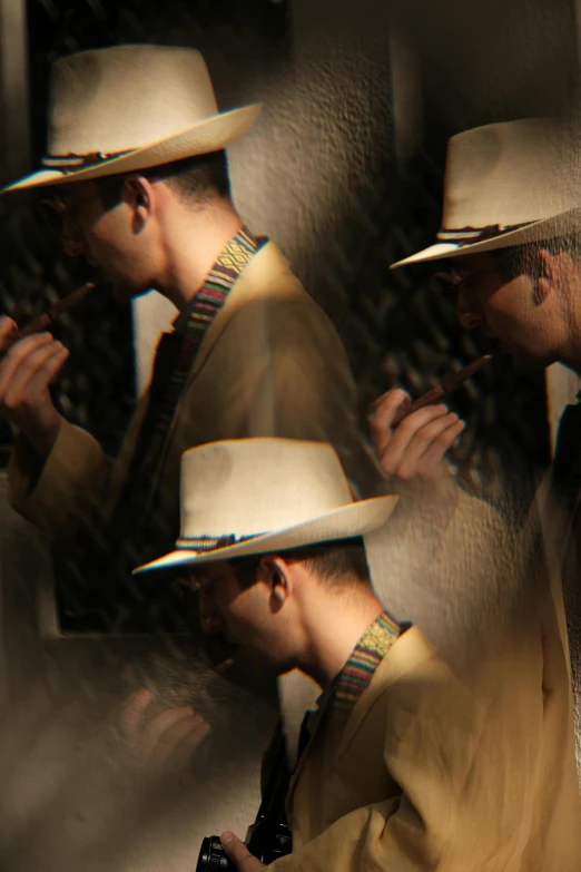 two men standing by a mirror with hats on