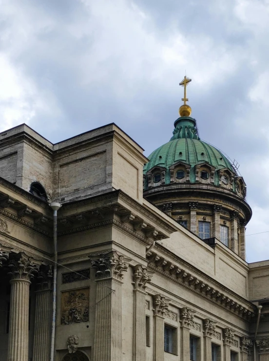 a building with a green dome on top