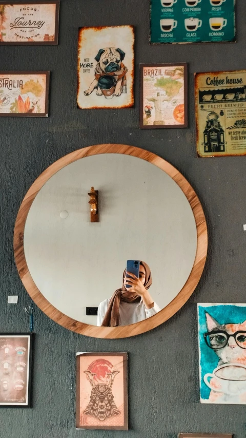 a woman is taking a selfie in the mirror