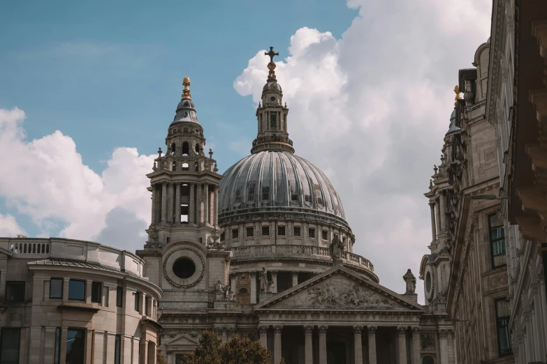 the two stone buildings have domes with crosses on them