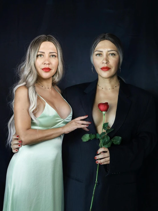 two woman with lipstick on their faces pose for the camera