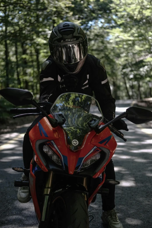 a motorcyclist on his bike in a helmet and goggles