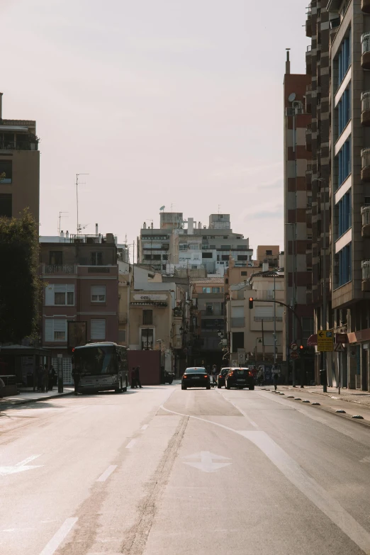 a street with several vehicles parked in it