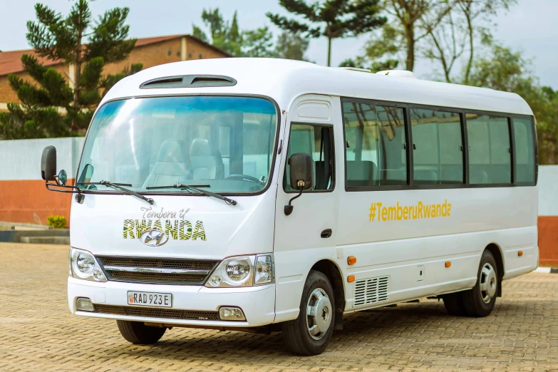 a white bus parked on the side of a street