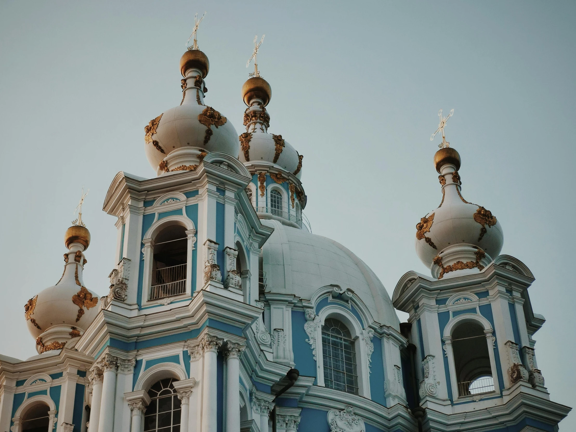 a very large building with two towers with clocks on it's side