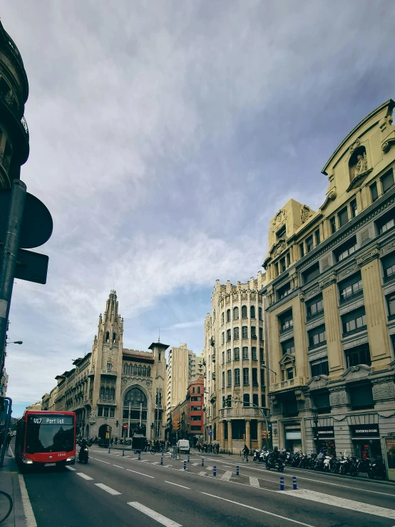 a city intersection is shown with tall buildings